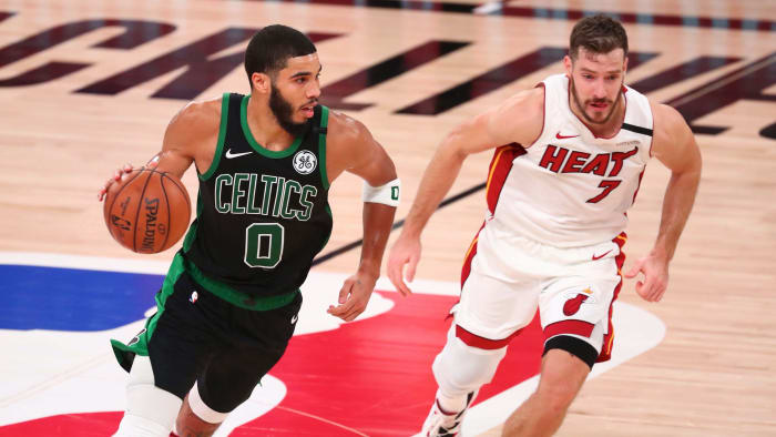 Boston Celtics forward Jayson Tatum (0) moves the ball against Miami Heat guard Goran Dragic (7) during the second half in game five of the Eastern Conference Finals of the 2020 NBA Playoffs at Advent...